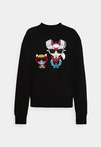 Felpa nera con una grafica di due personaggi dei cartoni animati che indossano occhiali da sole. Il personaggio più grande ha un design bianco e rosso con dettagli blu.