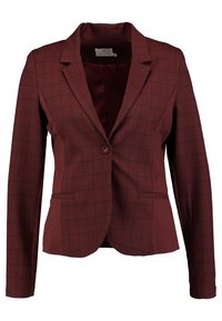 Burgundská blazerka s černým kostkovaným vzorem, s jedním knoflíkem, klopovými límci a dvěma předními kapsami.