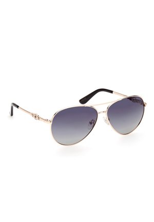 Occhiali da sole aviator con lenti grigie sfumate, montatura in metallo dorato e punte delle stecche in plastica nera texturizzata. Presentano un dettaglio con logo sui lati.