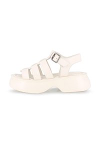 Sandalias de cuero blanco con una suela de plataforma gruesa, que presentan múltiples correas delgadas y un buckle lateral para ajuste. Textura suave.