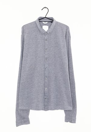 Gray long-sleeve button-up shirt made of textured fabric, featuring a collar, full front button closure, and buttoned cuffs.