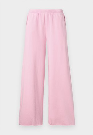 Pantalons large rose en tissu doux avec une taille élastique et des poches latérales. Présente une coupe droite et fluide.