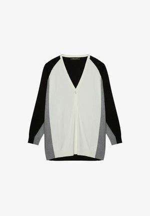 Cardigan cu decolteu în V, cu închidere prin buton, având un design în blocuri de culoare alb, negru și gri, și mâneci lungi raglan. Textură tricotată moale.