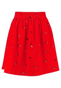 Jupe rouge avec une ceinture extensible, ornée d'une petite broderie florale blanche et marine. Tissu léger, s'évase légèrement à partir de la taille.