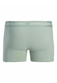 Boxers pour homme vert clair avec une large ceinture élastique portant la mention « Jack & Jones » en lettres blanches.