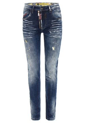 Dark blue jeans with distressed detailing, paint splatters, and a patterned waistband. Zippered fly with button closure, five-pocket design.
