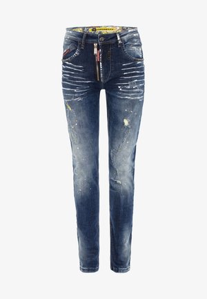 Dunkelblaue Jeans mit ausgefranstem Design, Farbspritzern und einem gemusterten Bund. Reißverschluss mit Knopfverschluss, Fünf-Taschen-Design.