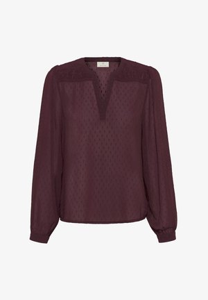 Blouse bordeaux à manches longues, avec un motif à pois texturé, décolleté en V et des détails froncés aux épaules, fabriquée à partir d'un tissu léger.