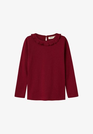 Ribbet, langærmet top i bordeaux med en flæset halsudskæring og knaplukning bagpå. Blød tekstur, tætsiddende design.