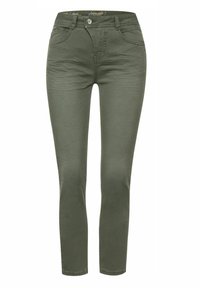 Ciemnozielone skinny jeansy wykonane z elastycznej bawełnianej tkaniny. Posiadają zapięcie na guzik z przodu oraz cztery kieszenie. Gładka tekstura.