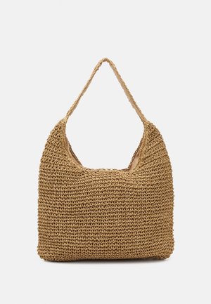 Wiklinowa torba na ramię z szerokim paskiem, jasnobrązowego koloru, o prostokątnym kształcie z zaokrąglonymi krawędziami.