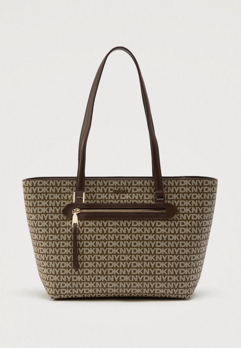 Tote torba s smeškim logotipom u smeškastoj boji, sa tamnosmeškim ručkama od veštačke kože, džepom sa rajsferšlusom i otvorenim vrhom. Ima široki pravougaoni oblik.