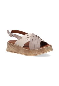 Light beige leather sandals with multiple overlapping straps, open toe, a tan cushioned insole, and a wedge sole with a textured wood finish.