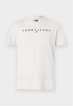 Svijetlosiva pamučna majica s okruglim izrezom, kratkim rukavima i crnim "TOMMYJEANS" logotipom preko prsa. Glatka tekstura.