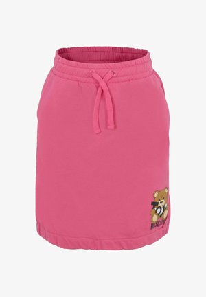 Gonna rosa con vita elastica e lacci, con grafica di un orsetto che tiene il testo "Giocattolo" vicino all'orlo.