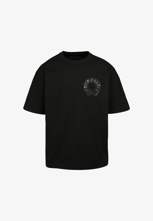 Must mustvalge t-särk, millel on ümmargune graafika sõnaga "Gonzales" ja kolju meenutav disain. Lühikesed varrukad ja ümmargune kaelus.