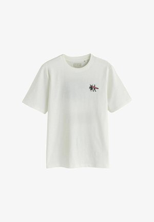 T-shirt blanc manches courtes avec un petit dessin sur la poitrine représentant une personne portant une planche de surf à côté d’une plante en pot.