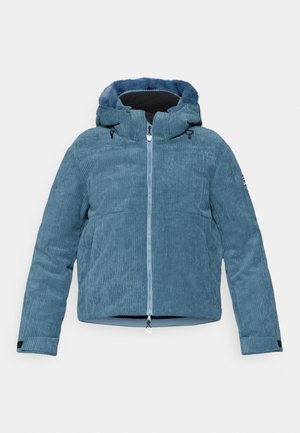 Giacca di velluto a coste blu chiaro con cappuccio foderato in pelliccia, chiusura con zip e tasche laterali. Tessuto a coste e cordini regolabili sul cappuccio.