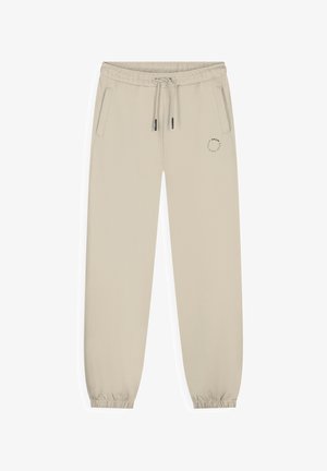 Beige joggingsbroek met elastische tailleband en pijpzomen, trekkoord, zijzakken en een klein rond logo op de linker dij.