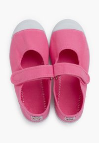 Pink canvas shoes featuring a rounded toe, elastic strap, white rubber toe cap, and textured inner lining.