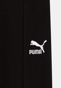 Puma CLASSICS SEASONAL  - Treniņtērpa apakšdaļas - black