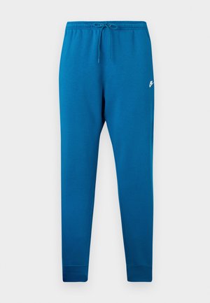 Pantalones deportivos azul con cintura elástica y cordón ajustable. Presenta un logo blanco en el muslo y puños ajustados en los tobillos.