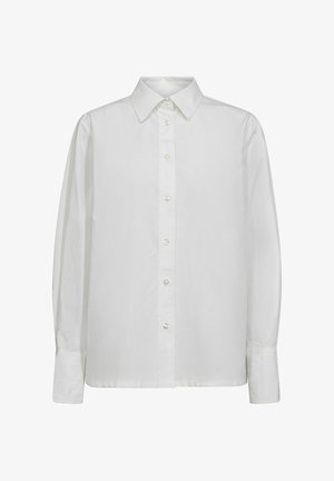 Bela srajca z dolgimi rokavi, izdelana iz gladkega bombaža. Ima klasičen ovratnik, zapiranje s gumbi s perlastim zaključkom in prilegajoče manšete.