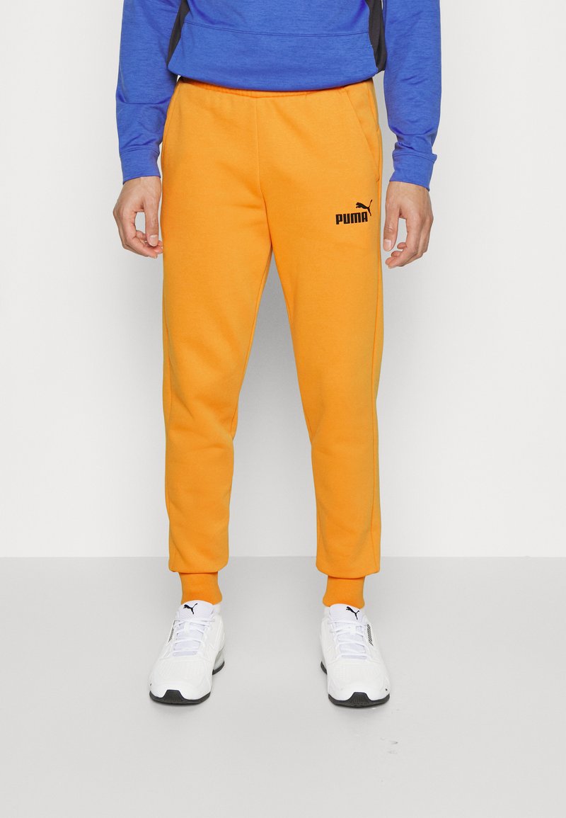 Puma LOGO PANTS Tracksuit bottoms desert clay/orange Zalando.co.uk