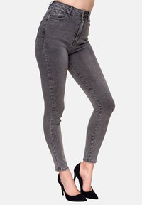 Jeans ajustados de cintura alta en denim gris oscuro. Presenta un diseño clásico de cinco bolsillos, lazos para cinturón y detalles de costura sutiles.