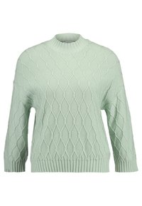 Ljust grönt stickat tröja med diamantmönster, mock neck och ribbad nederkant. Har lång ärmar och en avslappnad passform.