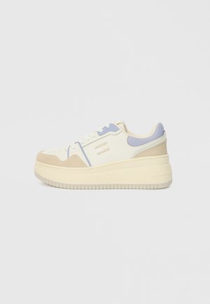 Platform sneakers in cream, tan, and lavender with a smooth leather and suede finish, featuring a textured sole and lace-up front.