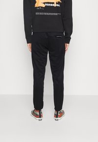 Jack & Jones JJIWILL JJSPRING  - Calças de fato de treino - black