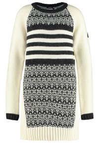 Kremowy sweter z dzianiny z czarnymi wzorami, z poziomymi paskami w górnej części i dekoracyjną dolną sekcją.