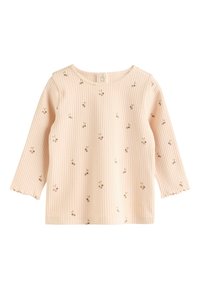 Beige ribbed long-sleeve toddler shirt with small cherry prints and a snap button closure at the back neckline.
