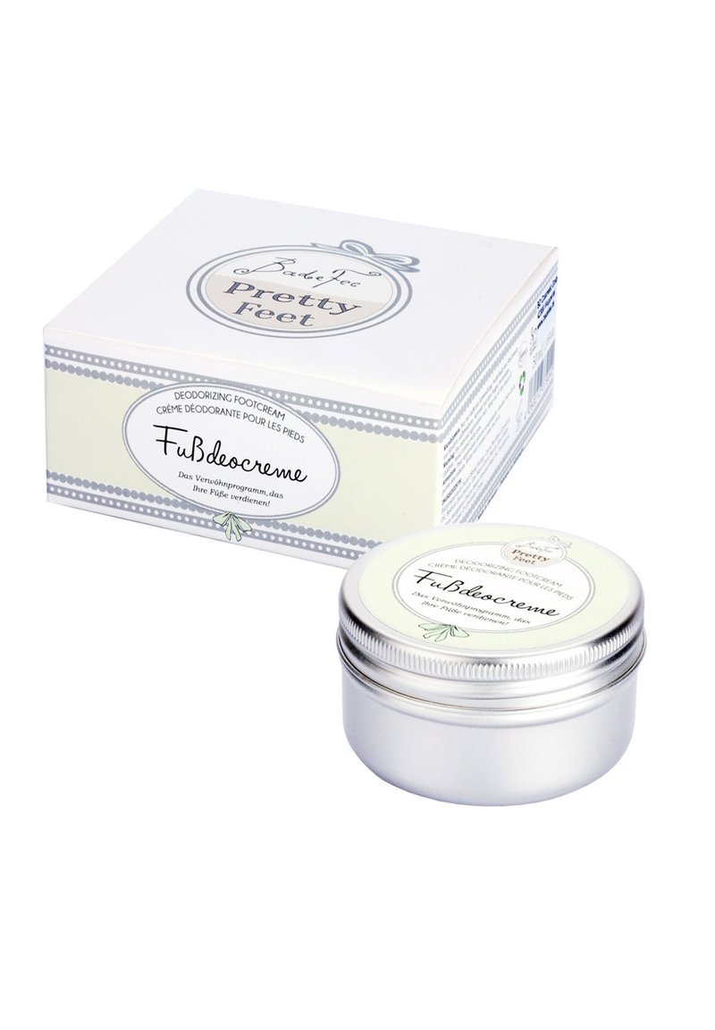 Deodorizing foot cream in a small silver tin with a white label. Packaging features a light-colored box with decorative accents.