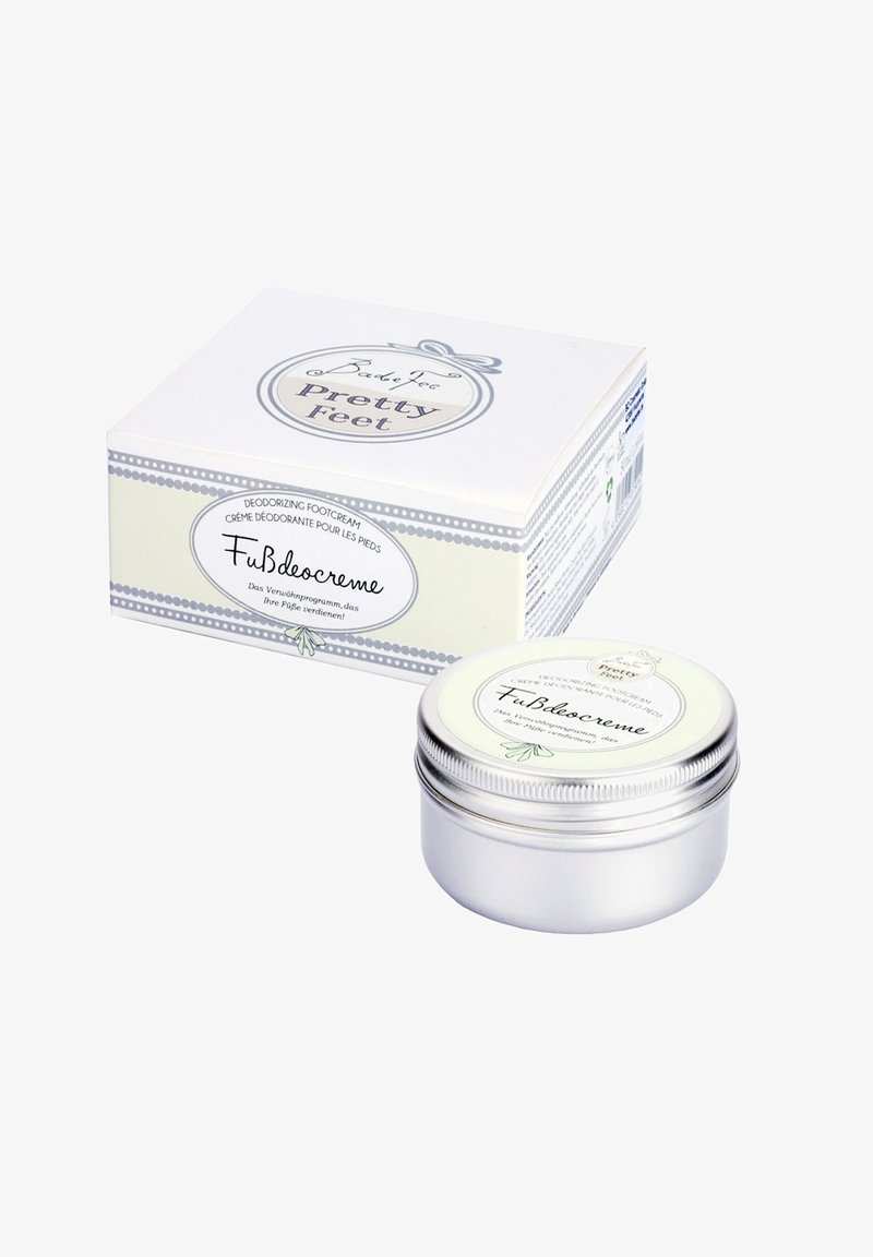 Deodorizing foot cream in a small silver tin with a white label. Packaging features a light-colored box with decorative accents.