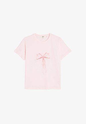 Pink cotton t-shirt featuring a central red watercolor bow print. Short sleeves and a relaxed fit, with a round neckline.