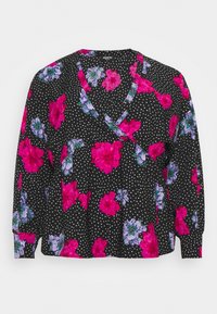 Blouse noire à manches longues avec un design cache-cœur, décorée de grandes imprimés floraux roses et violets ainsi que de petits pois blancs.