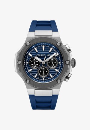 Hodinky so modrým silikónovým remienkom, nerezovým puzdrom, modrým textúrovaným ciferníkom, tromi sub-ciferníkmi a striebornými akcentmi. Obsahujú výrazné hodinové značky.