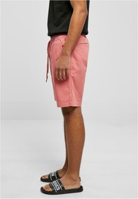 Urban Classics Verryttelyhousut - palepink