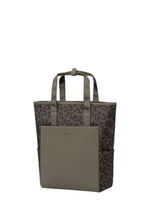 Tote bag with leopard print fabric, solid front pocket, two handles, and side pockets in neutral brown tones.