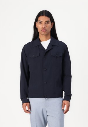 Navy button-up jacket featuring long sleeves, two chest pockets, and a clean flat collar with a structured fit. Crafted from durable fabric.