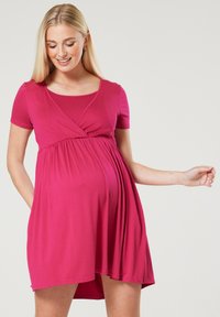 Pink maternity dress with a wrap design, short sleeves, and a gathered waist for comfort. Made from soft, stretchy fabric.