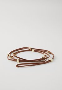 Brown leather strap bracelet featuring gold geometric accents. The design includes multiple intertwined strands with smooth texture.