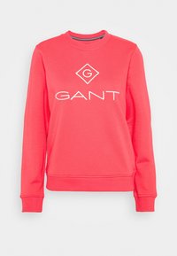 Felpa a girocollo color corallo realizzata in un tessuto morbido, con un logo "GANT" ricamato di colore bianco e un accento a forma di diamante sul fronte.