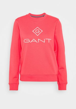 Felpa a girocollo color corallo realizzata in un tessuto morbido, con un logo "GANT" ricamato di colore bianco e un accento a forma di diamante sul fronte.