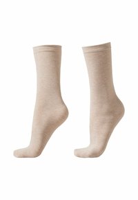Beiga bomullssockor med en slät yta, midjehöjd och en något ribbad kant. Enkel design utan ytterligare mönster eller detaljer.