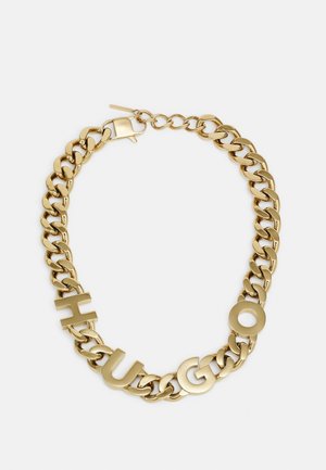 Gold-tone chain necklace with large interlocking links and letters spelling "HUGO" spaced along the chain, with a lobster clasp closure.