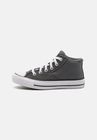 High-top gray canvas sneaker with white rubber toe cap, white laces, and black outsole stripe. Features textured fabric and metal eyelets.