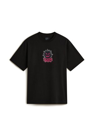 T-shirt in cotone nero con una grafica davanti che presenta un personaggio dei cartoni animati con spuntoni e la parola "VANS" in corsivo rosa. Maniche corte.